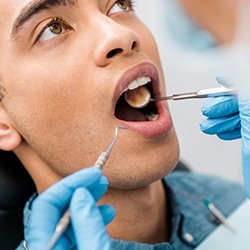 Closeup of dentist examining patient's teeth