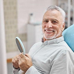 Male patient checking smile after cosmetic bonding in Arlington, TX