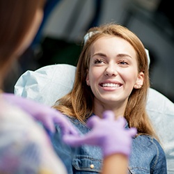 patient smiling while getting cosmetic dentistry in Arlington