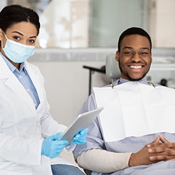 Smiling patient and dentist at checkup