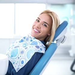 Smiling woman sitting in dental office