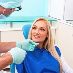 patient smiling while visiting emergency dentist in Arlington