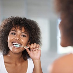 Woman brushing her teeth