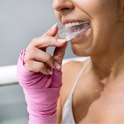 a person wearing mouthguards to protect dental implants in Arlington