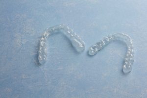 A pair of Invisalign clear aligners.