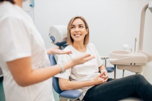 woman chatting with her cosmetic dentist 