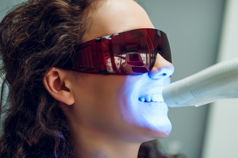 person at dentist having teeth whitened