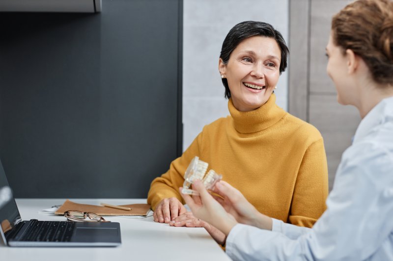 Patient talking to dentist about dentures 